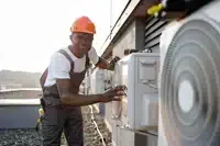 small-200x133-african-man-in-uniform-checking-air-conditioner-on-2023-12-21-22-00-43-utc.jpg